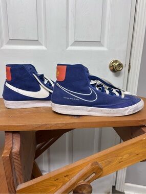 Nike High-Top Sneakers in Navy Blue with White Swoosh and Orange Heel Tab